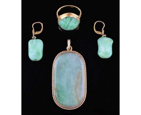 Large Jade panel pendant, in a 9ct gold mount, a circular carved jade panel mounted in a ring, stamped '18ct', size P, 4g gro