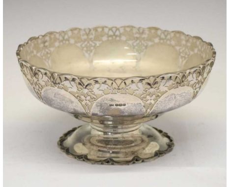 George V silver pedestal bowl having pierced floral border and standing on a circular base, with frosted glass dish, Sheffiel