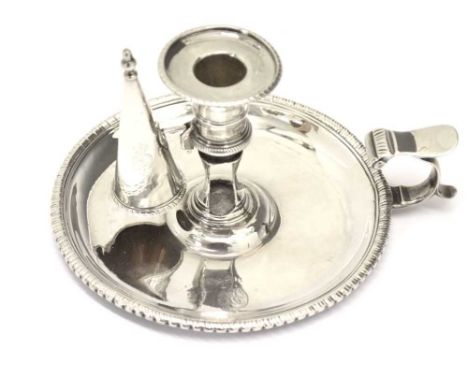 George III silver chamberstick of circular form with a beaded rim and scroll handle, London 1767, sponsors mark of William Ca