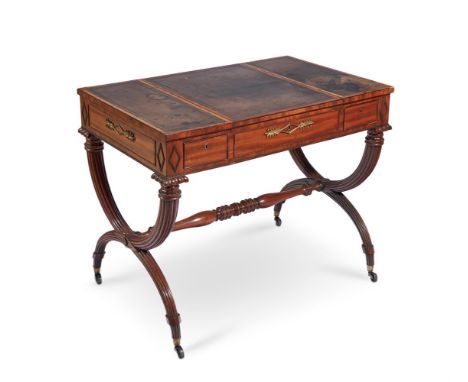 A REGENCY MAHOGANY AND GILT METAL MOUNTED WRITING AND GAMES TABLE IN THE MANNER OF MARSH & TATHAM, CIRCA 1815With tooled leat