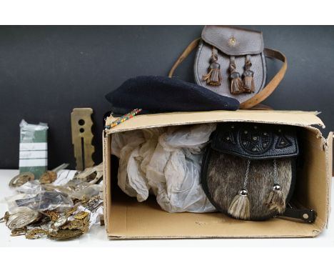 A collection of mixed militaria to include badges, buttons, patches, dagger sporrans and uniform.