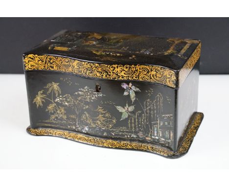 Victorian black lacquered twin compartment tea caddy with shaped front, the lid inlaid abalone shell and gilt decoration depi