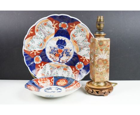 Two Japanese Imari wall charger plates together with a Japanese Satsuma ware lamp base decorated with floral sprays. Lamp mea