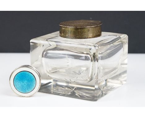 A large antique cut glass inkwell with hallmarked sterling silver top together with a sterling silver pill box with guilloche