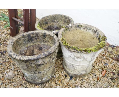 Three 20th Century reconstituted stone planter flower pots, each having moulded garland and classical detailing to the sides.