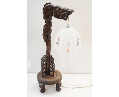 Art Deco era Chinese carved hard wood table lamp carved into the form of a Chinese dragon with pierced fretwork detailing, ra