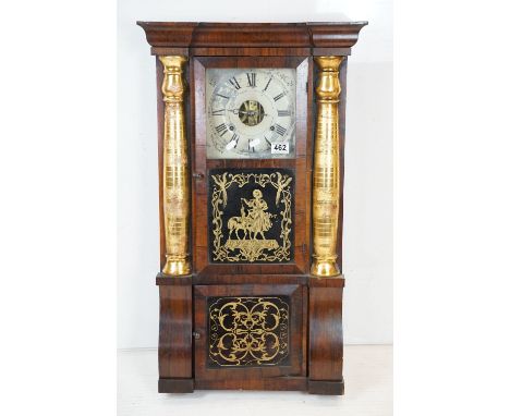 Early 20th Century American eight day pendulum wall clock by Seth Thomas having a mahogany case with twin gilt columns and tw