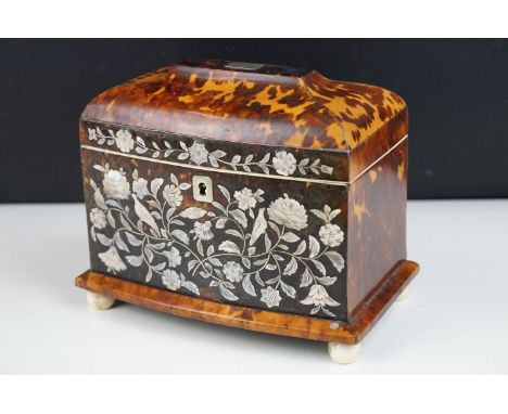 19th Century tortoiseshell twin compartment tea caddy, of sarcophagus form, with detailed mother of pearl inlaid decoration d