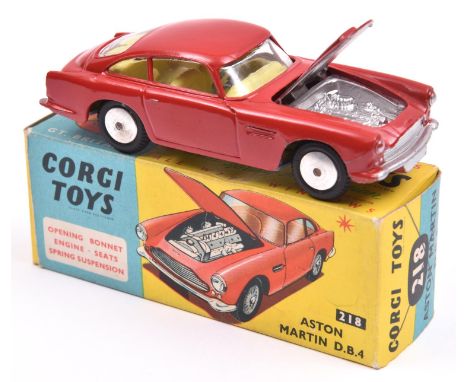 Corgi Toys Aston Martin DB4 (218). A scarce example in red with yellow interior, closed bonnet vent, smooth wheels and black 