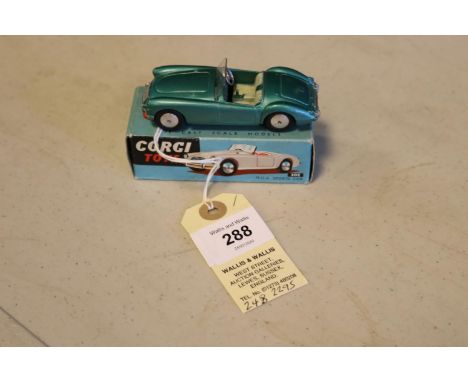 Corgi Toys M.G.A. Sports Car (302). In metallic green with cream seats, smooth spun wheels and complete with screen. In early