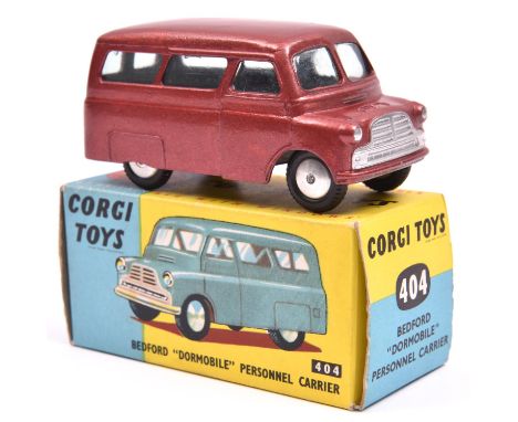Corgi Toys Bedford Dormobile Personnel Carrier (404). A split screen 1st type in metallic cerise with smooth spun wheels and 