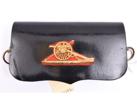 A late 19th century R Artillery bandsman’s (?) pouch,  black PL with brass ring belt mounts and nicely detailed gilt cannon o