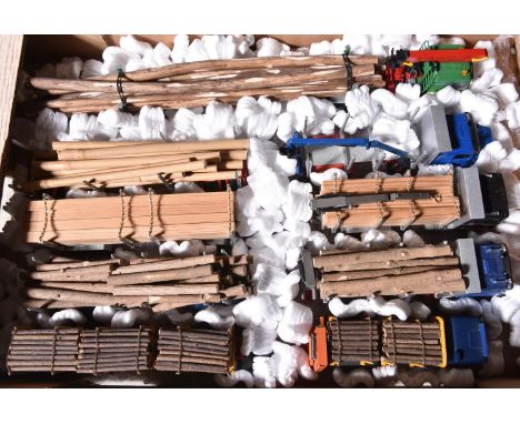 5 various makes of logging trucks by Conrad and a Dutch Tekno. 4 Conrad- MAN forward control 3 axle tractor unit equipped wit