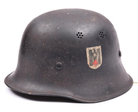 A Third Reich Police pattern double decal steel helmet of the DRK (German Red Cross), with matt black finish having party and