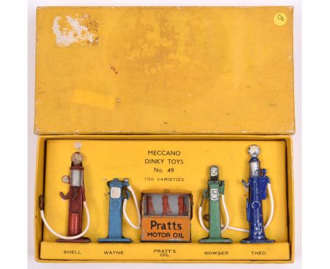 A Dinky Toys Petrol Pumps set No.49. An early example with 4 pumps- SHELL in red, Wayne in mid blue, Bowser in mid green and 