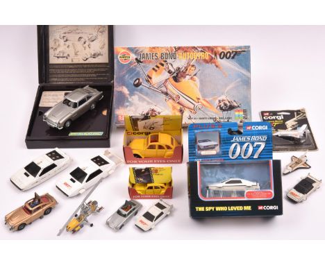 Quantity of James Bond related toys by various makers. A Scalextric Aston Martin DB5 (1st of 3 Limited Editions) in silver. B