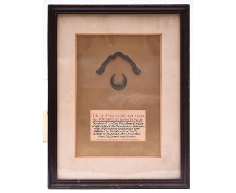 A brass scroll “Percy Tenantry”, and a crescent, mounted and framed with details “These emblems are from the Helmet of John D