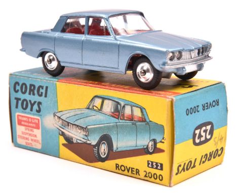 Corgi Toys Rover 2000 (252). In metallic light blue with red interior, dished spun wheels and black tyres. Boxed, minor wear/