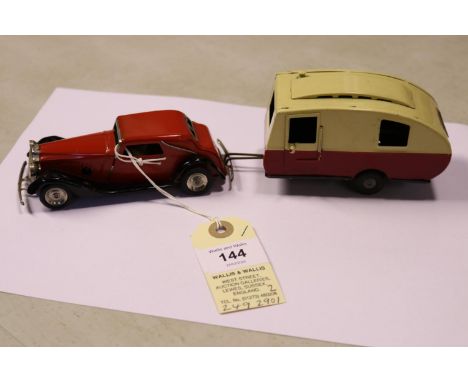 2 Tri-ang Minic. A clockwork Vauxhall Cabriolet 19M. An example in red with black wings and chassis, tinplate wheels with bla