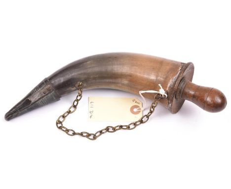 A powder horn,  brass sprung nozzle, ring mounts and chain, darkwood base with screw plug, 11” overall. Basically GC (some ag