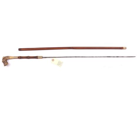 An early 20th century swordstick, slightly wavy round section blade 22½”, slender brown wood haft and knopped section of hand