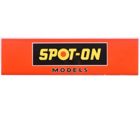A Tri-ang Spot-On glass advertising sign. Yellow lettering with white border in a black square with orange background. Dimens