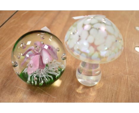 Two paper weights one being a lamp worked flower and a similar lustre glaze glass mushroom