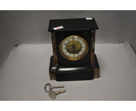 A Victorian mantle or bracket clock having slate and marble case with enamel face
