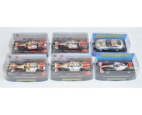 Five Scalextric 1/32 scale McLaren Mercedes Formula 1 racing slot car models to include C2985 Lewis Hamilton No1, C2986 Heikk