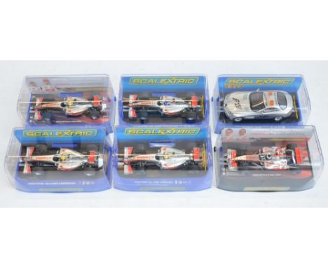 Five Scalextric 1/32 scale McLaren Mercedes Formula 1 racing slot car models to include C2806 F.Alonso No1, C3043 Lewis Hamil