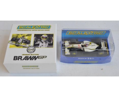 Two Scalextric 1/32 scale Brawn GP Formula 1 racing slot cars to include Commemorative limited edition C3047A Jenson Button B