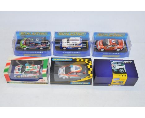 Six Scalextric rally slot racing car models to include limited edition C2487A Skoda Fabia WRC Works No14 (1230/4000), C2885 P