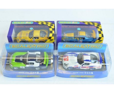 Four 1/32 scale Competition Coupe Dodge Viper racing slot car models from Scalextric to include C2907 Naykid Racing No3 (smal