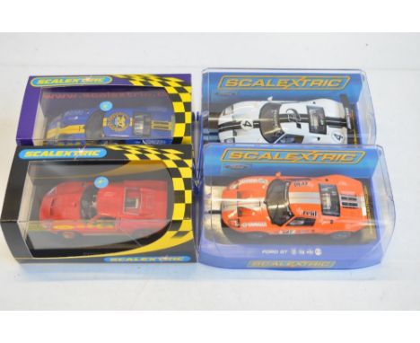 Four Scalextric 1/32 scale Ford GT40 slot car racing models to include C2424 MkII Collectors Club 2003 (clear case cracked), 