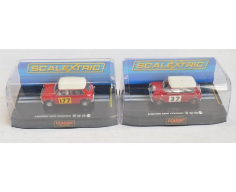 Eight boxed Scalextric 1/32 scale Morris Mini slot car models to include Wizardry On Wheels limited edition C2980A 1959 Mini 