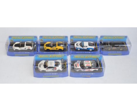 Six 1/32 scale Scalextric racing slot car models to include 4x Lotus Exige, C3509 V6 Cup R Orange, C3513 V6 Cup R White, C352