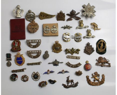 Collection of military badges from various countries and eras. WWI tank regiment, R.A.F. enamel sweetheart brooch (2), King O