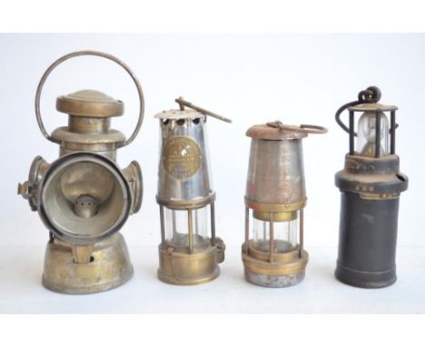 Four vintage metal lamps to include Wolf Safety Lamp, a Type 6 Eccles safety lamp by The Protector Lamp &amp; Lighting Co Ltd