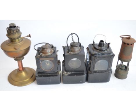 Five vintage metal paraffin lamps to include 3 railway lamps one marked LNER, another BR(E) and the third unmarked but with 5