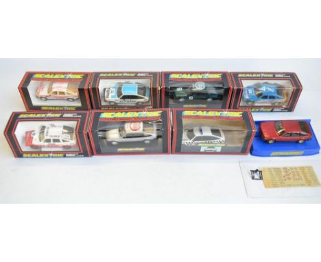 Eight vintage Scalextric 1/32 scale Rover 3500 models to include C362 Police car (missing box insert), C562 Silver NSCC 1966 