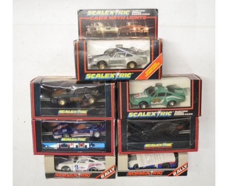 Seven vintage Scalextric slot car models to include C288 Silver Porsche With Lights (excellent little used condition, box fai