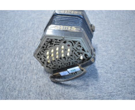 A Jeffries 32 button Anglo concertina , one button missing and needs a tidy up but bellows seem OK, no case