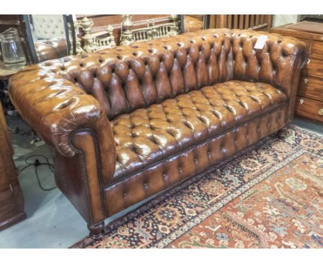 CHESTERFIELD SOFA, vintage buttoned hand finished leaf brown leather, with rounded back and seat and turned supports, 206cm W