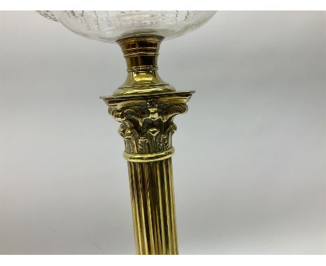 Victorian brass oil lamp, the square stepped base leading to a Corinthian column supporting a part slice cut clear glass rese