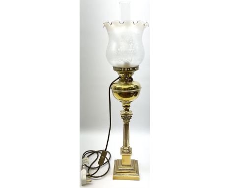 Brass oil lamp, the square stepped base leading to a Corinthian column supporting a brass reservoir, burner, clear glass chim