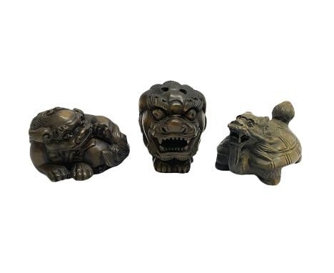Three netsuke, modelled as mythical creatures 