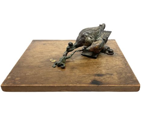 Austrian cold painted bronze note holder, the sprung loaded clamp in the form of two ducks holding a frog, on an oak base, cl