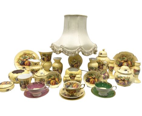 Collection of Aynsley Orchard Gold pattern wares, comprising lamp base, three jars and covers, six vases or various size and 