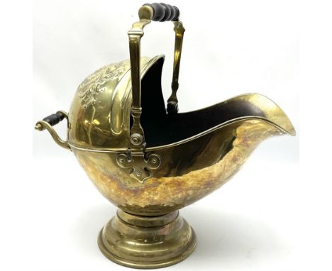 Victorian brass coal scuttle, of helmet form with turned ebonised handles, H48cm