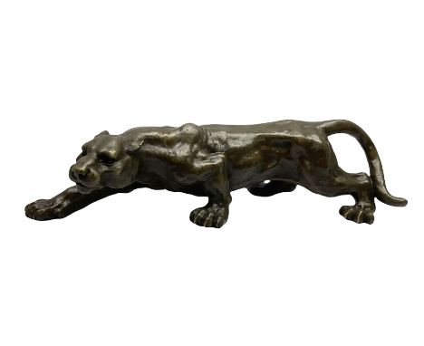 Bronze figure of a crouching cougar after 'Milo', with foundry mark, L42cm